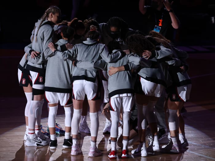Stanford Cardinal players huddle on the court prior to their game against the Arizona Wildcats in the national championship game of the women's Final Four of the 2021 NCAA Tournament at Alamodome.